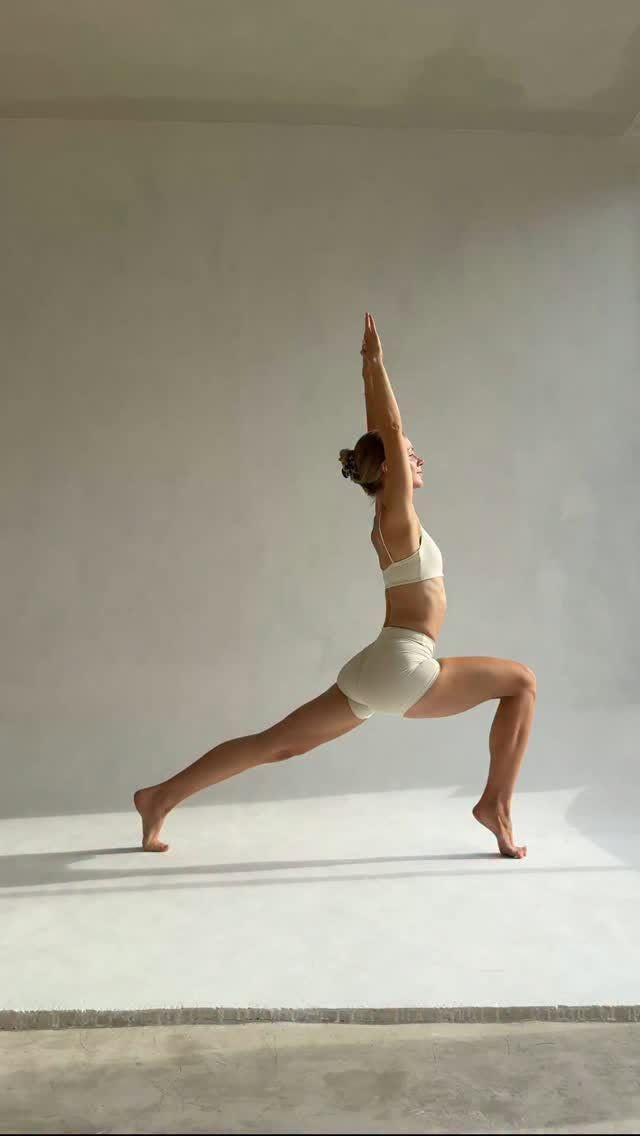 Practitioner in a dynamic Power Yoga pose demonstrating strength and athleticism